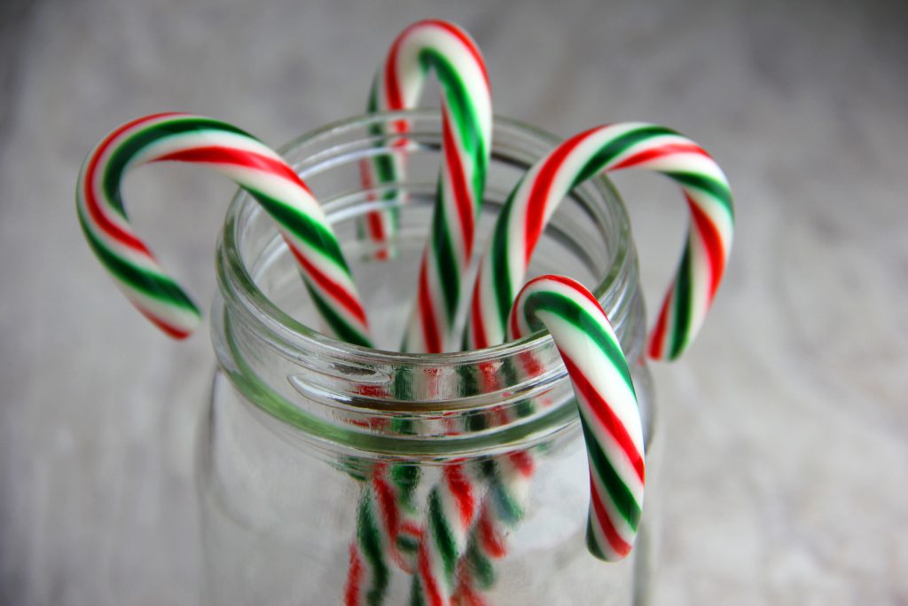 Candy Canes In A Glass Jar Set On A White Background Sourcing And Recht 5965